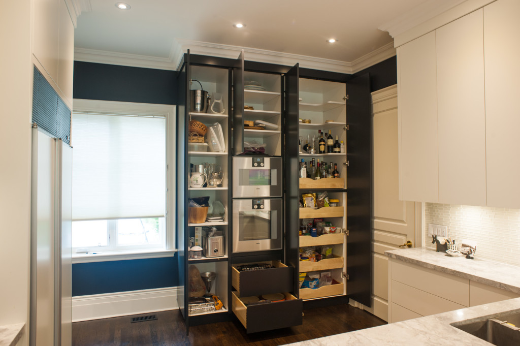 Open kitchen cabinet doors to show interior organization