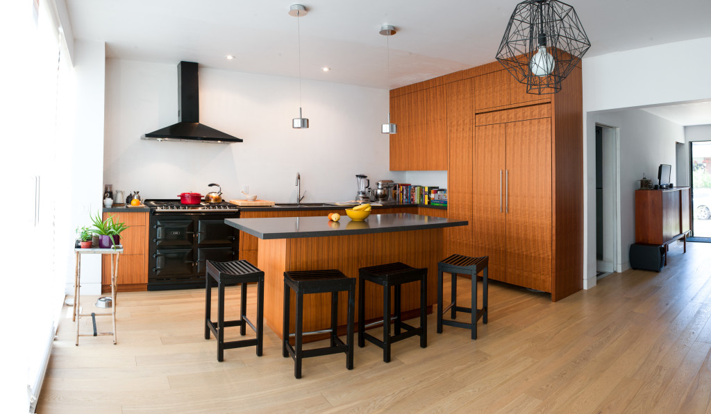 Contempory kitchen with walnut veneer